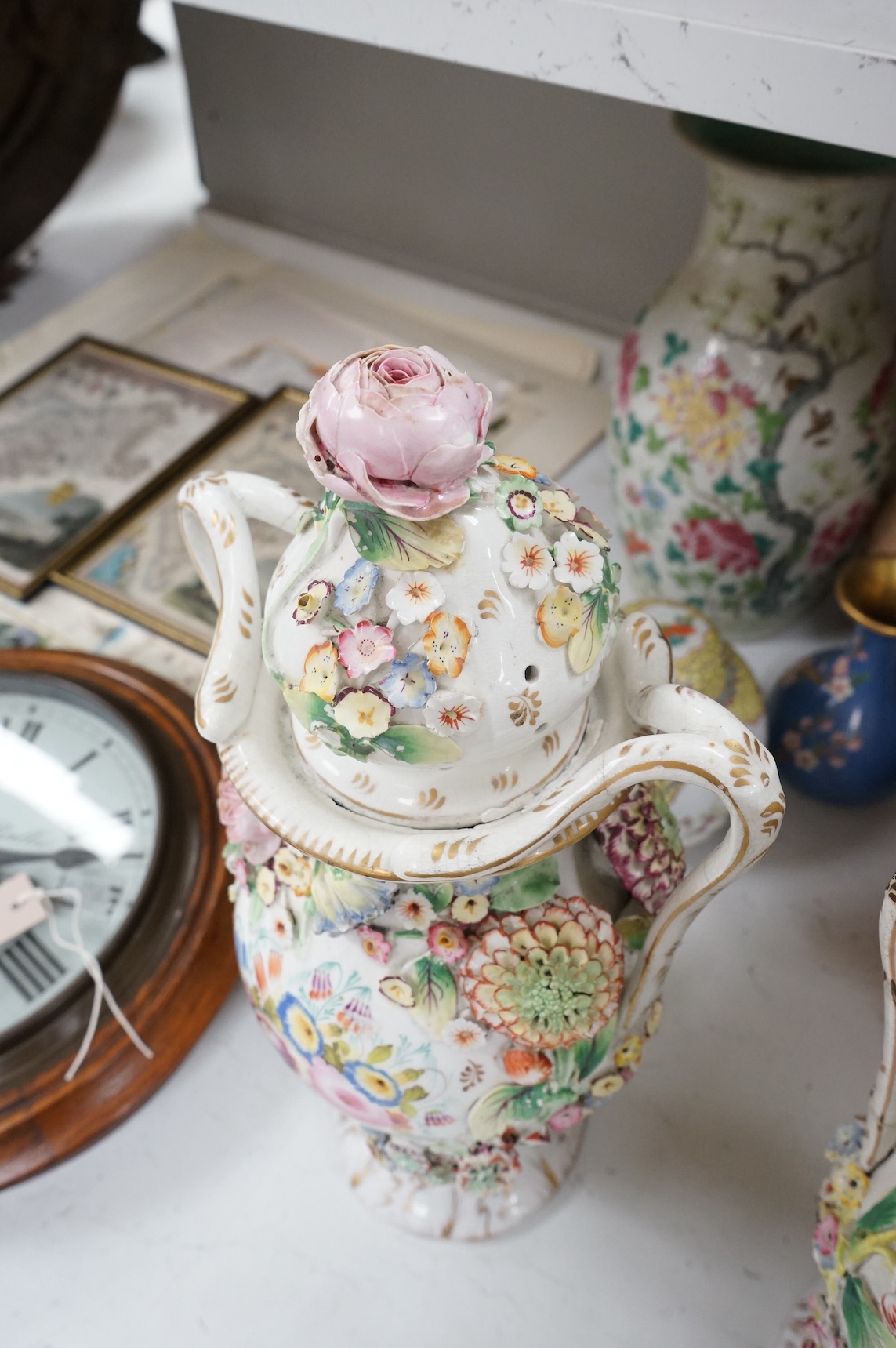 A pair of Victorian Staffordshire porcelain floral-encrusted vases and covers, 44cm high. Condition - some damage